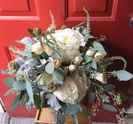 Bohemian bouquet of ivory peonies, peach spray roses, scabiosa pods, veronica and eucalyptus