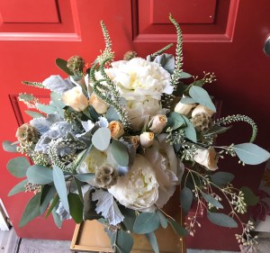 Bohemian bouquet of ivory peonies, peach spray roses, scabiosa pods, veronica and eucalyptus