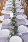 $119 - centerpiece reception table garland of greens, baby's breath and spray roses