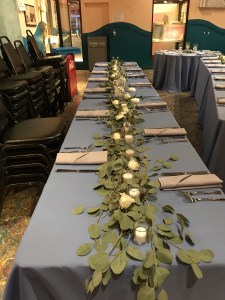 $145 - reception centerpiece garland of loose greens, roses and votive candles