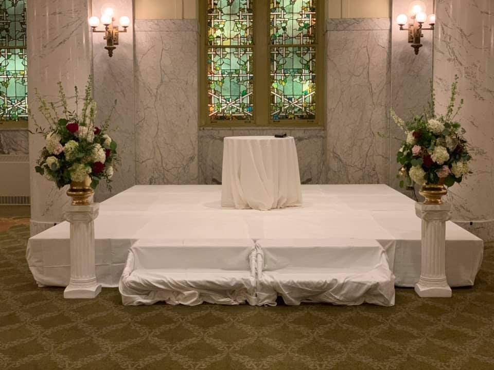 $159 ea - ceremony flowers on rental columns