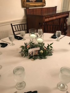 $36 - floating candles & greens centerpiece for reception