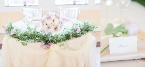 $47 - sweetheart table garland and repurposed bouquet for reception