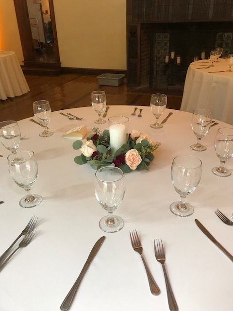 $49 - reception table candle with loose greens and roses
