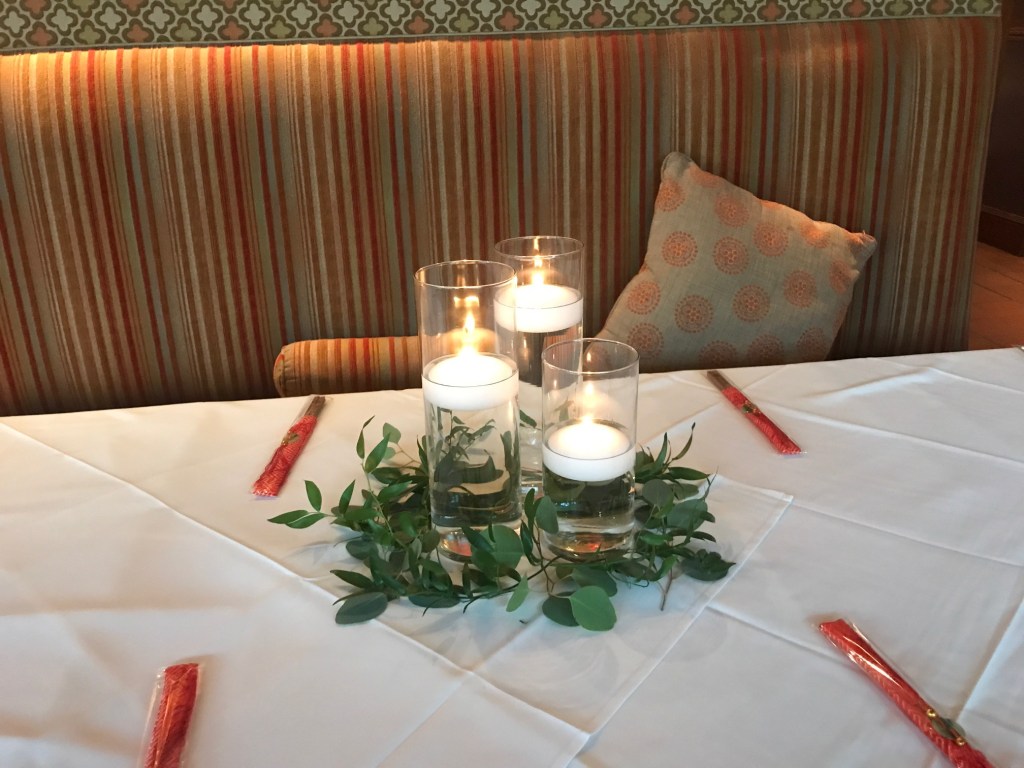 3 floating candles with loose greenery, rental candles